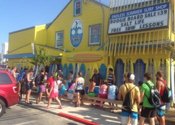 people waiting outside the endless summer surf shop