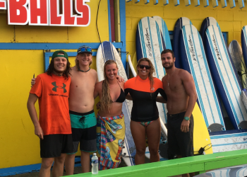 Endless summer surf instructors posing for photo