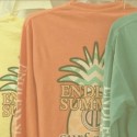 long sleeve shirts hanging on rack with endless summer logo on the back