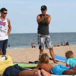 instructors explaining how to surf to kids in Ocean City MD