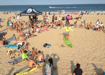 kids being taught how to surf in ocean city md